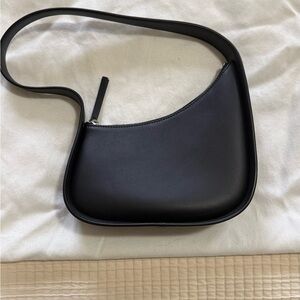The Row half moon bag